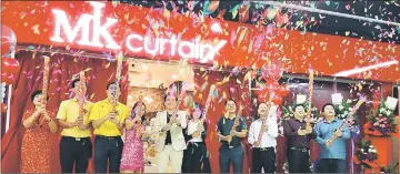  ??  ?? MK Curtain in East Malaysia launched with a shooting of confetti by Moon (sixth left), Khiu (fifth left) and other invited guests.