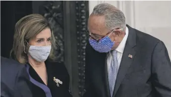  ?? ALEX BRANDON/POOL/GETTY IMAGES ?? House Speaker Nancy Pelosi and Senate Majority Leader Chuck Schumer at the U.S. Capitol on Friday before the arrival of the casket of Justice Ruth Bader Ginsburg.