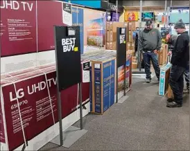  ?? Darron Cummings / Associated Press ?? Large retailers offer “buy now, pay later” when customers check out. This payment method is spreading to small businesses, too.