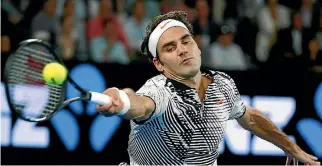  ?? REUTERS ?? Roger Federer stretches for a forehand during his semifinal against Stan Wawrinka.