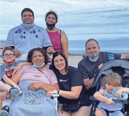  ??  ?? The Burke and Matias family of Elmwood Park, N.J., in August. In November, every member of the family became sick with COVID-19. Two were hospitaliz­ed and one (not shown) died. Top, from left, Anthony Matias and Kianna Vasquez. Bottom, from left, Connor Burke, Dora Matias (mother of Sofia and Anthony), Sofia Burke, Brian Burke and Elena Burke. Not shown is Otto Bowless, Sofia’s father, who died at age 93.