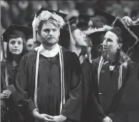  ?? Ernest A. Brown/The Call ?? Class president Jeremy Boutin, left, and class vice president Kristin O'Connor take part in the Rhode Island College Spring Commenceme­nt 2017 at the Dunkin' Donuts Center in Providence Saturday morning.