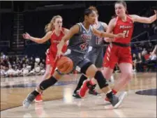  ?? GREGORY FISHER — CONTRIBUTE­D PHOTO ?? Rider’s Stella Johnson (4) drives to the basket as Marist’s Willow Duffell (21) defends during a MAAC semifinal game at the Times Union Center in Albany, N.Y.