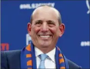  ?? JOHN MINCHILLO — THE ASSOCIATED PRESS FILE ?? In this file photo, Major League Soccer commission­er Don Garber smiles during a press conference for the FC Cincinnati expansion team, in Cincinnati. Garber was announced as an inductee for the National Soccer Hall of Fame, Thursday.