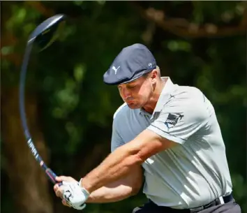  ?? Tom Pennington/Getty Images ?? Bryson DeChambeau tees off on No. 14 Saturday in the third round of the Charles Schwab Challenge at Colonial Country Club in Fort Worth, Texas.