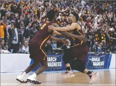  ?? The Associated Press ?? UPSET-MINDED: Loyola-Chicago guards Donte Ingram (0) and Marques Townes celebrate their 64-62 win over Miami Thursday in the first round of the NCAA Tournament in Dallas. The Ramblers advanced to the Sweet 16 with a 63-62 win over Tennessee on Saturdy.