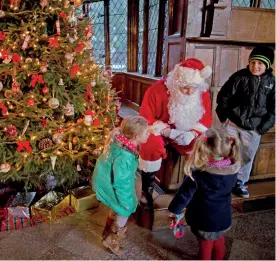  ??  ?? Children meeting Father Christmas at Speke Hall, Liverpool. Many seasonal events are taking place at National Trust properties.
©NATIONAL TRUST IMAGES, ARNHEL DE SERRA