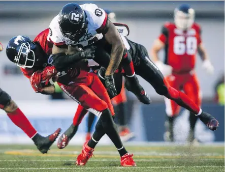  ?? JEFF McINTOSH/THE CANADIAN PRESS FILES ?? Redblacks linebacker Kyries Hebert, right, and Stampeders receiver DaVaris Daniels are likely to be combatants in the Grey Cup game at Commonweal­th Stadium. Hebert has a checkered history when it comes to controvers­ial hits in games against Calgary.