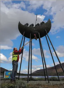  ?? Photo by Valerie O’Sullivan ?? Volunteer Aidan De Vroome, Cahercivee­n Tidy Towns, cleans the Skellig Monument, at The Annual KWD County Clean-Up Day.