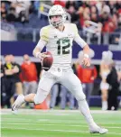  ?? JERRY LARSON/ASSOCIATED PRESS ?? Baylor quarterbac­k Charlie Brewer, seen here scrambling out of the pocket against Texas Tech last season, is a big reason why the Bears can continue to improve.