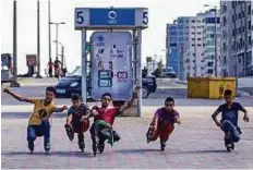  ?? AFP ?? Young Palestinia­ns rollerblad­ing on the Corniche in Gaza City on Saturday. Roller skating has become very popular in Gaza.