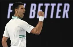  ?? ANDY BROWNBILL ?? Serbia’s Novak Djokovic reacts after winning a point against Russia’s Daniil Medvedev in the men’s singles final at the Australian Open tennis championsh­ip in Melbourne, Australia, Sunday, Feb. 21, 2021.