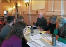  ?? ARIEL ZANGLA — DAILY FREEMAN ?? Guy Kempe, top center, vice president of community developmen­t for RUPCO, speaks to a group at an Equitable Developmen­t Community Workshop Thursday evening at City Hall in Kingston, N.Y.