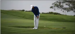  ?? DENIS POROY — THE ASSOCIATED PRESS ?? Tiger Woods hits his second shot on the fourth hole during the pro-am round of the Farmer’s Insurance golf tournament on the South Course at Torrey Pines Golf Course on Wednesday in San Diego.