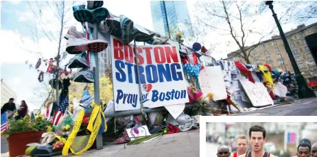  ??  ?? » Top Crowds continued to gather at the Boston Marathon bombing memorial on Boylston Street in Boston on May 3, nearly three weeks after the attacks