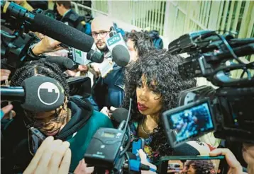  ?? PIERO CRUCIATTI/GETTY-AFP ?? Politician not guilty: Performer Marysthell Garcia Polanco meets the media Wednesday at a Milan courtroom after former Italian Premier Silvio Berlusconi was found not guilty of witness tampering in a trial related to sexually charged parties held at his villa while in office. The decision ended a six-year trial for Berlusconi, 86, who was not in court.