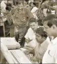  ?? UNI ?? Officials check EVMs ahead of the assembly polls in Karnataka