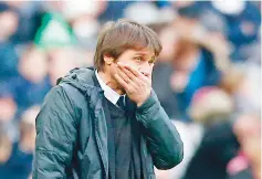  ?? — AFP photo ?? Chelsea’s Italian head coach Antonio Conte gestures on the touchline during the English Premier League football match between West Ham United and Chelsea at The London Stadium, in east London on December 9, 2017.