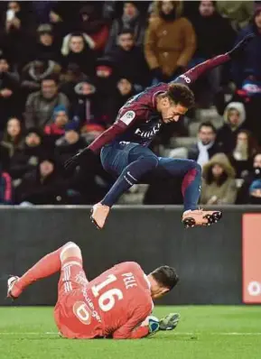  ?? EPA PIC ?? Paris Saint Germain’s Neymar jumps over Marseille goalkeeper Yohann Pele in their Ligue 1 match on Sunday.