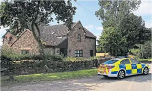  ??  ?? Police at a house in Caverswall, Staffordsh­ire, during the hunt for Samantha