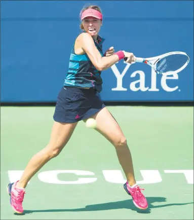  ?? Michael Cummo / Hearst Connecticu­t Media ?? Anett Kontaveit hits a forehand shot against Pauline Parmentier during a second-round match at the Connecticu­t Open in New Haven on Tuesday. Kontaveit won the match 3-6, 6-2, 6-2.