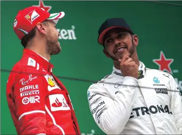  ?? Picture: ROMAN PILIPEY, EPA ?? WE’LL SEE WHO LAUGHS LAST: Lewis Hamilton and Sebastian Vettel are both on 43 points ... the deadlock must be broken in Bahrain.