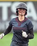  ?? ?? Kingston’s Navaeh Sullivan grins as she rounds second after her home run hit against Central Kitsap on March 22.