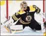  ?? Michael Dwyer / Associated Press ?? The Bruins’ Tuukka Rask deflects a shot during the first period against the Capitals on Sunday in Boston.