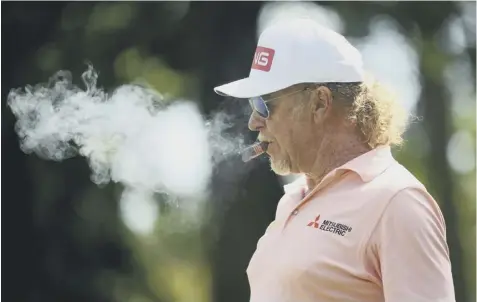  ??  ?? 0 Miguel Angel Jimenez enjoys a cigar on the putting green before setting out for his first round in the Hero Open.