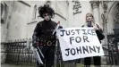  ??  ?? Johnny Depp supporters hold a banner outside the High Court earlier this year during his libel hearing against tabloid, 'The Sun'