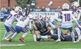  ?? ?? Winnacunne­t recovers the onside kick on the opening kickoff of Saturday’s Division I game at Exeter.