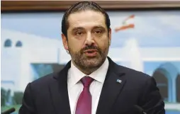  ?? (Mohamed Azakir/Reuters) ?? LEBANESE PRIME MINISTER Saad Hariri speaks yesterday after a cabinet meeting in Baabda, near Beirut, during which he withdrew his resignatio­n.