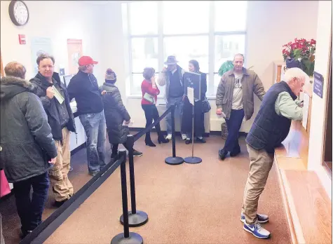  ?? Hearst Connecticu­t Media file photo ?? Long lines at the tax collector’s department, as seen here in 2017, may be a thing of the past, but a rush of payments are expected next week as residents face an April 1 payment deadline to get their winter tax payments in or face four months of interest penalties.