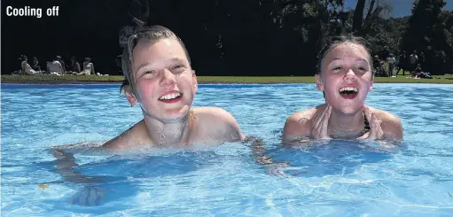  ?? PHOTO: GREGOR RICHARDSON ?? Southern summer Christmas . . . stepsiblin­gs Tristin CareyBaile­y (left) and Skyla Cherry (both 12) take a dip at the Woodhaugh Gardens yesterday.