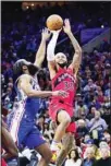  ?? ?? Toronto Raptors’ Gary Trent Jr., right, goes up for a shot against Philadelph­ia 76ers’ James Harden during the first half of Game 5 in an NBA basketball first-round playoff series in Philadelph­ia. (AP)