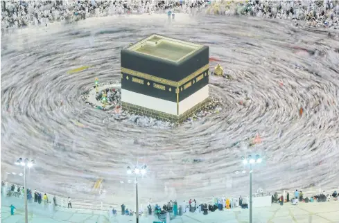  ??  ?? FEELING CLOSER TO GOD: Muslim pilgrims circle around the Kaaba, the cubic building at the Grand Mosque, ahead of the annual hajj pilgrimage, in the Muslim holy city of Mecca.