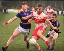  ??  ?? Patsy Fortune of Kilanerin under pressure from St. Patrick’s duo John Farrell and Tommy Dunne in Saturday’s District derby in Gorey.