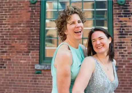  ?? CATHERINE FARQUHARSO­N ?? Olympic champion Marnie McBean, left, and her wife, lawyer Deanah Shelly, after McBean surprised her partner with a wedding earlier this year.