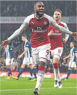  ?? Pictures: Getty Images. ?? Above: Arsenal striker Alexandre Lacazette celebrates the first of his two goals last night; right: West Brom’s Gareth Barry, who made his record 633rd Premier League appearance.