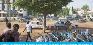  ?? — AFP ?? BAMAKO: Cars belonging to the Kanaga driving school are pictured in the Badalaboug­ou neighborho­od of Bamako.