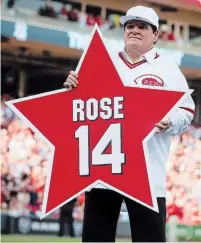  ?? ASSOCIATED PRESS FILE PHOTO ?? Pete Rose holds his place marker during a ceremony to honour the 1976 World Series champion team in 2016.