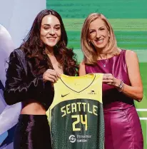  ?? Photos by Sarah Stier/Getty Images ?? Aaliyah Edwards poses with WNBA Commission­er Cathy Engelbert after being selected sixth overall pick by the Washington Mystics during the 2024 WNBA Draft at Brooklyn Academy of Music, Monday in New York City. At right, Nika Mühl poses with Engelbert after being selected 14th overall pick by the Seattle Storm.