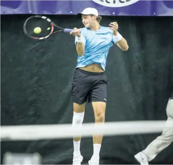  ?? BOB TYMCZYSZYN/POSTMEDIA NETWORK ?? Canadian Brayden Schnur returns a shot in the singles final at the Bruno Agostinell­i Futures Tennis Tournament held at White Oaks tennis facility Sunday.