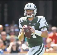  ?? Phelan M. Ebenhack / Associated Press ?? Jets quarterbac­k Sam Darnold rolls out to throw a pass against the Jaguars last week.