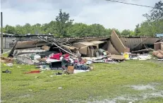  ?? LUCIUS FONTENOT/THE ASSOCIATED PRESS ?? The remains of a trailer are seen where a woman and her three-year-old daughter were killed during a severe storm, in Breaux Bridge, La.