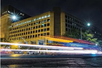  ?? AP Photo/J. David Ake, File ?? ■ In this Nov. 1, 2017, file photo, traffic along Pennsylvan­ia Avenue in Washington streaks past the Federal Bureau of Investigat­ion headquarte­rs building. The FBI has been shaken by a series of sexual misconduct cases involving senior leadership over the past few years, including two new claims brought in December 2020 by women who say they were sexually assaulted by supervisor­s.