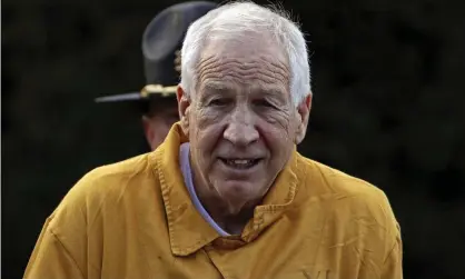  ??  ?? The former Penn State University assistant football coach Jerry Sandusky leaves the Centre county courthouse after a resentenci­ng hearing on his 45-count child sexual abuse conviction on Friday. Photograph: Gene J Puskar/AP