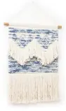  ??  ?? Ena blue fabric wall hanging, £59.50, Oliver Bonas