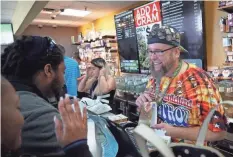  ??  ?? “Budtender” Jason Coleman describes the effects of a lubricant infused with marijuana at the Medicine Man cannabis dispensary in Denver in April.