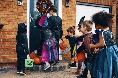  ?? ?? Pictures: GETTY
TRICK OR SWEET: Halloween was a festival for honouring the dead and celebratin­g the harvest. Below, Autry